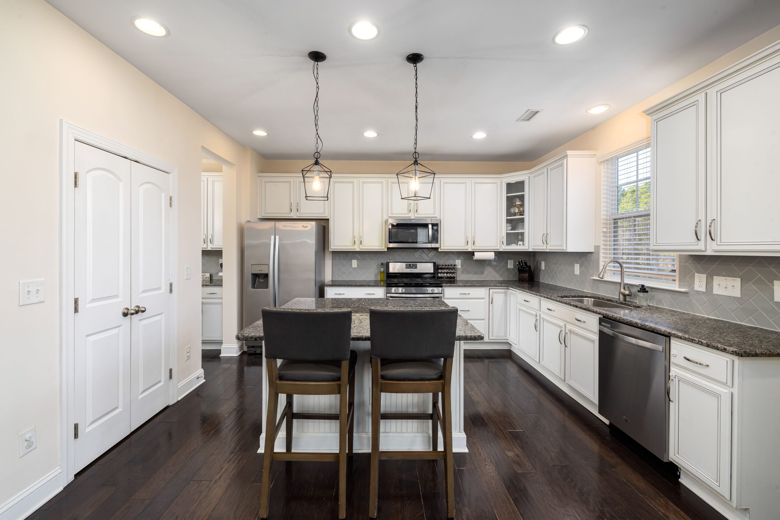 Modern kitchen with recessed ceiling lights and an island